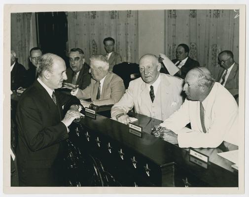 Members of House Ways and Means Committee talk to Henry Morgenthau. Left to right: Vinson, Thomas Cullen, R.L. Doughton, and Pat Harrison
