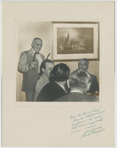 Vinson with Truman holding two guns as a joke. Signed by Herb F. Dolglish