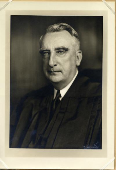 Chief Justice Vinson in judicial robe enclosed in folder