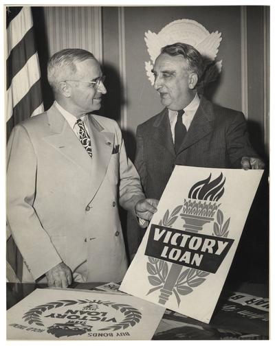Secretary of the Treasury Vinson and President Truman flash Victory Loan sign