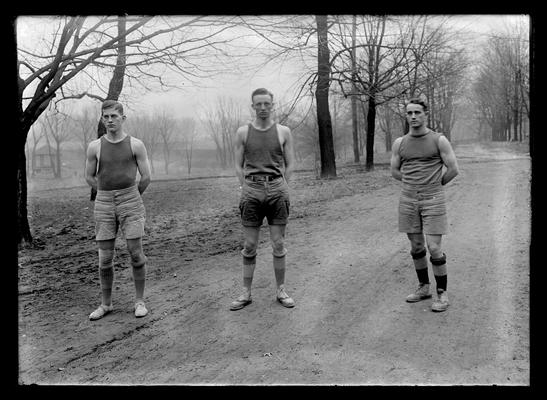 Tom Zerfoss, three basketball players on roadway