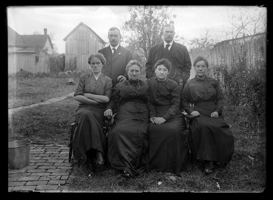 Dicker family, two men, four women, two of them seated on ground