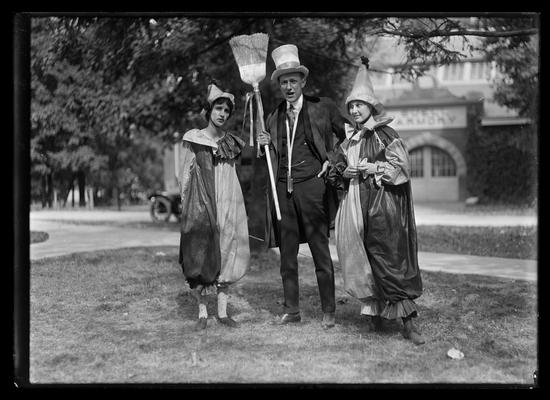 Golden Jubilee, two girls in clown suits, man with broom
