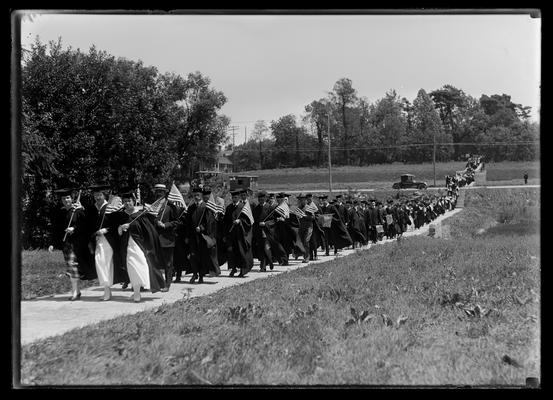 Commencement procession from Patterson Hall, across Euclid and in front of site of S.U.B