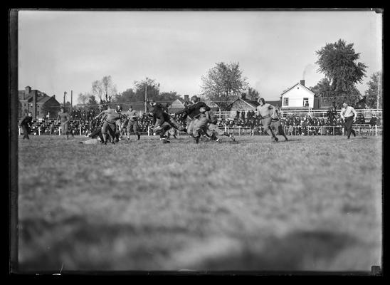 Football action picture, Walton Dempsey and Hiram Adair