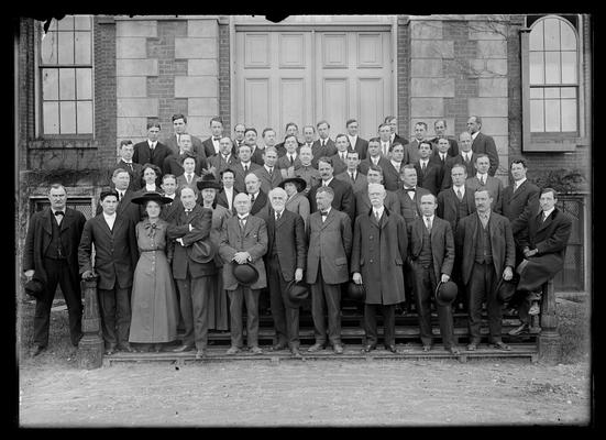 Faculty 1912, both Pattersons absent, three women wearing hats
