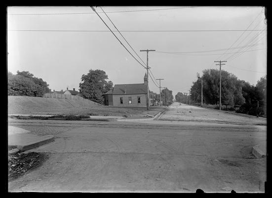 View of the corner of South Limestone and Euclid (Winslow) Streets, Lexington, Kentucky, including Consolidated Baptist Church, houses, and people standing in the background