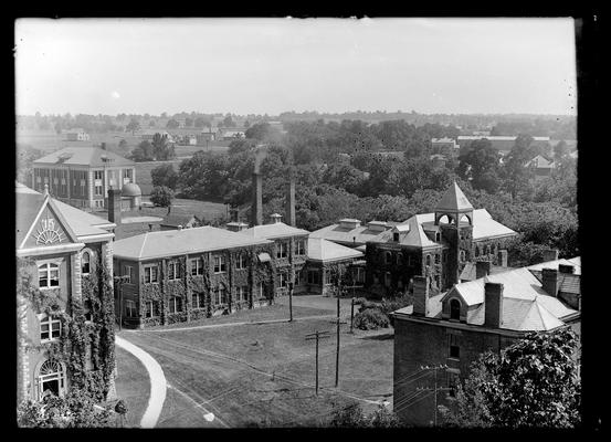 View from top of Administration Building (Main Building), Engineering Buildings, Observatory, New Chemistry Building (Gillis Building) and buildings on farm in background, roof of Neville Hall in right foreground