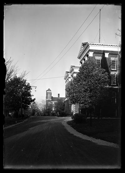 Main drive looking north to Barker Hall, Administration Building (Main Building) to right, light pole to left