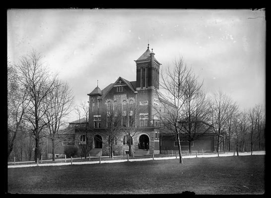 Winter view of Barker Hall, three men on steps of right entrance