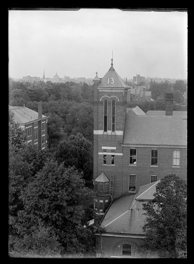 Number 13 on tower of Barker Hall, Frazee roof to left, city in distance