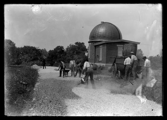 Observatory, men working on ground around building