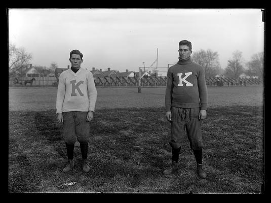 Football players, Skinny Campbell on left, left guard, Big Tom Earle, right guard, on right