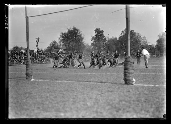 Football game at Lexington, University of Kentucky won 41-0 against University of Louisville, action framed by goal posts