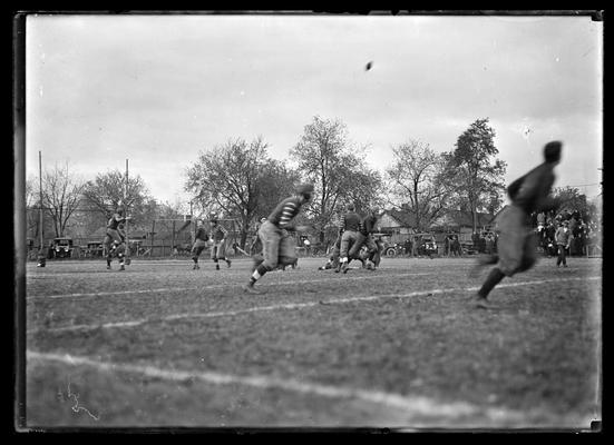 Football game at Lexington, Virginia Military Institute 3-2 against University of Kentucky, player in right foreground out of focus