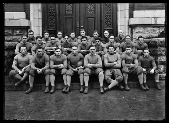 Football squad on steps of Carnegie Library, back row: James Park on left, Daddy Boles on right, Captain John Brittain