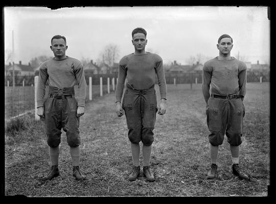 Football players in group of three: John Heber, end, Edward Pullen, fullback, Arthur Shanklin, halfback