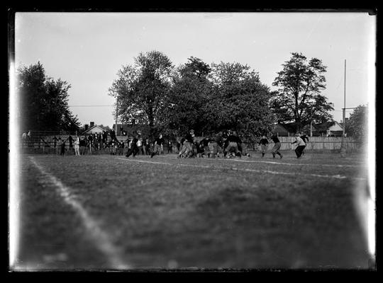 Football action, on five yard line, goal post on right of picture