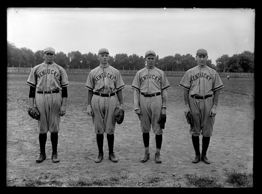 Four baseball players: Lesley, Thomas, McClelland, Kohn, all wearing or holding mitts