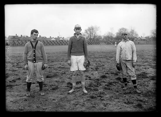 Three baseball players: man on right is Taylor, pitcher