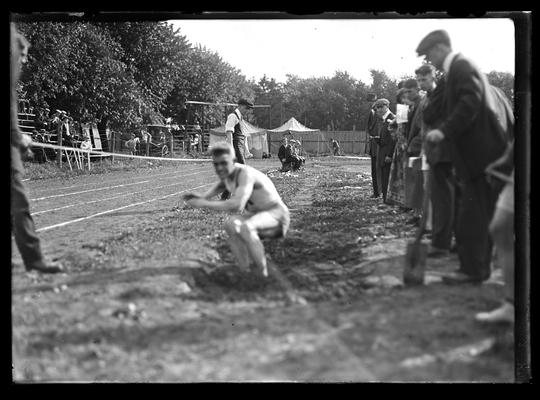 Track ment, tent, horse and buggy in background