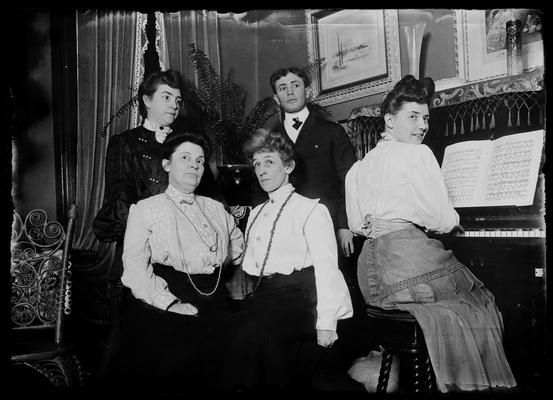 Mrs. Anderson and group, one at piano