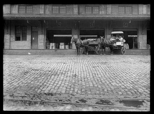 Vine Street Freight Depot, Commerce Street side, sections 52 through 54, one-horse wagons at 53 and 54
