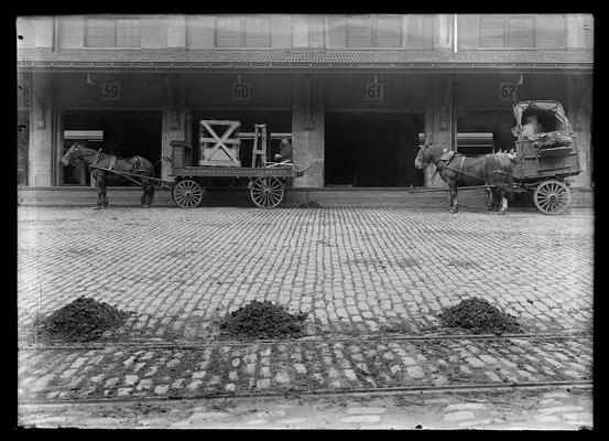 Vine Street Freight Depot, Commerce Street side, sections 59 through 62, one-horse wagons at 60 and 62