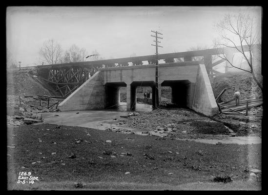 Bridge 126.9, east side, three men seen at distance