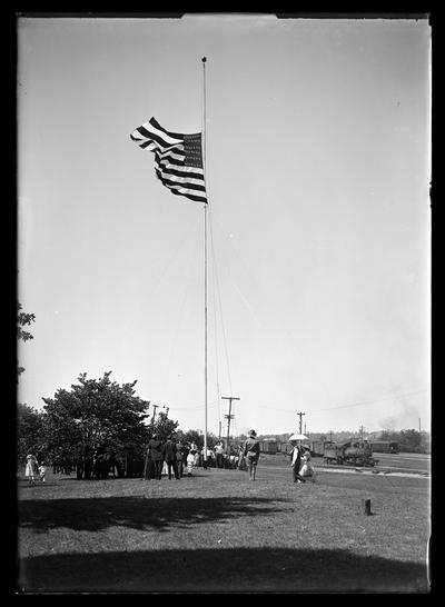 Flag raising at Southern __ Depot, flag nears top