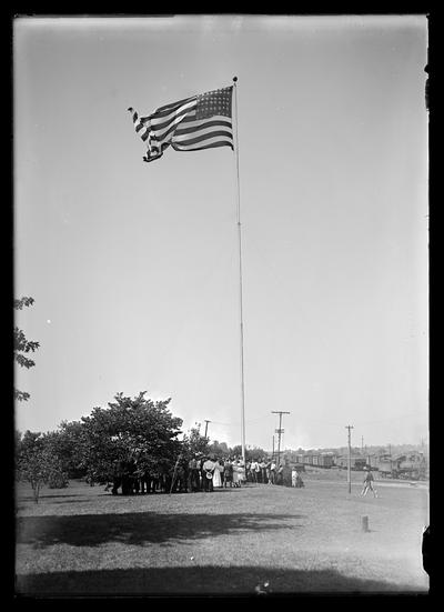 Flag raising at Southern __ Depot, flag floating breeze