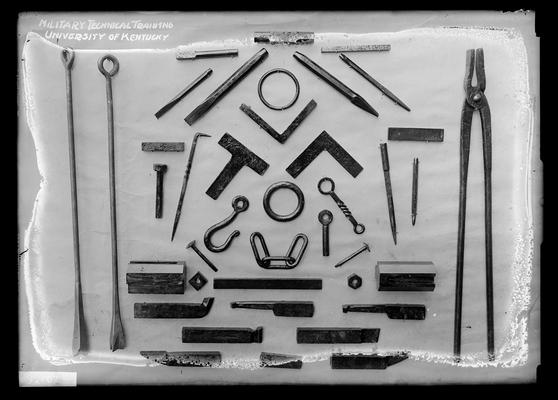 Display of items made in forge shop, notation Military technical training, University of Kentucky