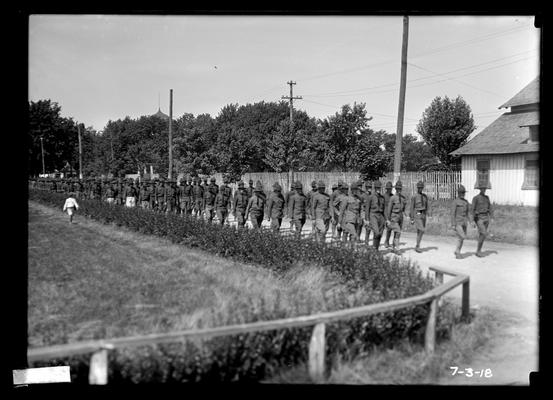 Soldiers marching around track at camp (Fair Grounds)