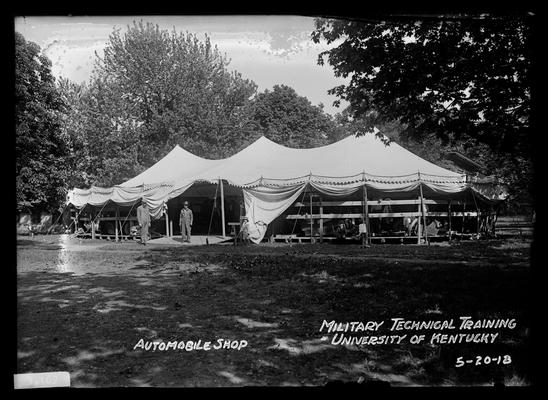 Tent with sides up, exterior view, notation automobile shop