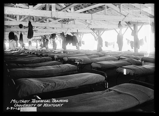 Interior view of barracks, cots all made