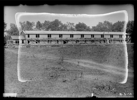 View from distance, roof complete, two or three men on roof