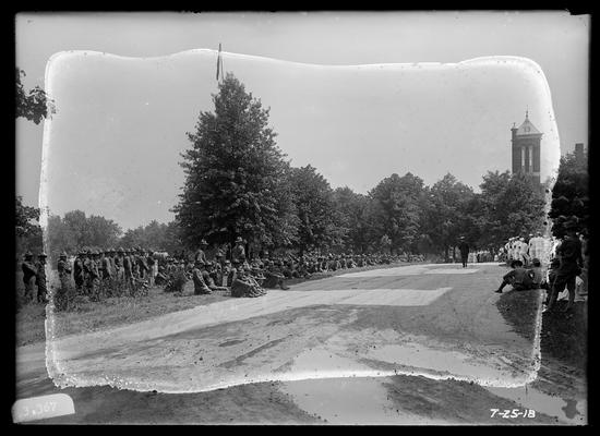 Groups seated, standing, main drive, top of Barker Hall right background