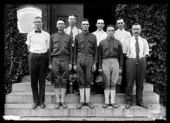 Carpenter and blacksmith instructors, Dicker in right front, outside Anderson Hall