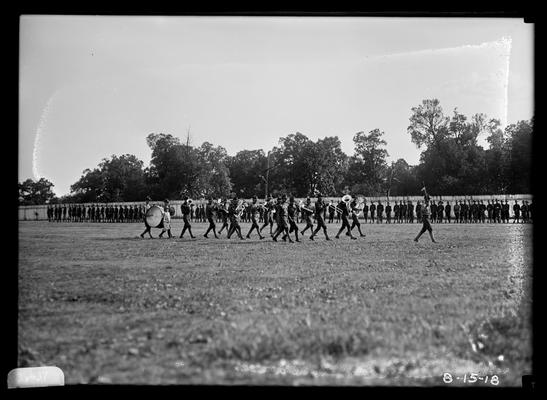 Band marching in front of assembled men, notation Parade rest