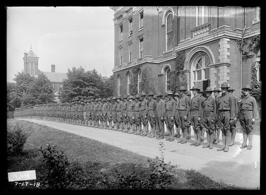 Men on main drive, backs to Administration Building (Main Building), no arms, Notation Company B 48 hours after arrival