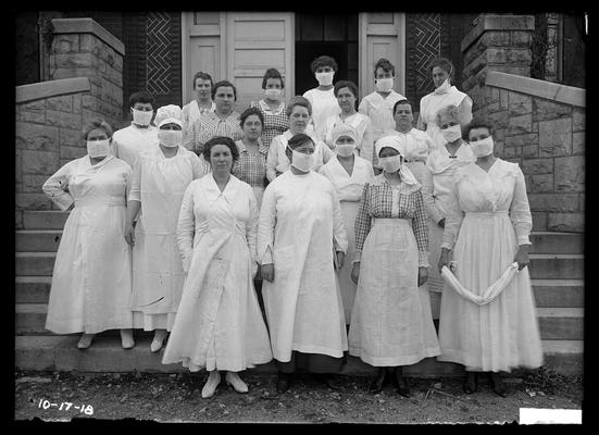 Nurses and aides on steps of Miller Hall, some with masks (during flu epidemic)