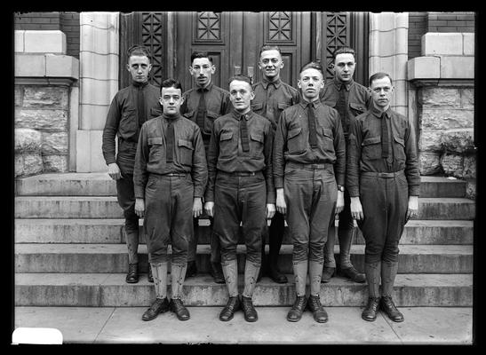 Eight men in uniforms on steps of Carnegie Library