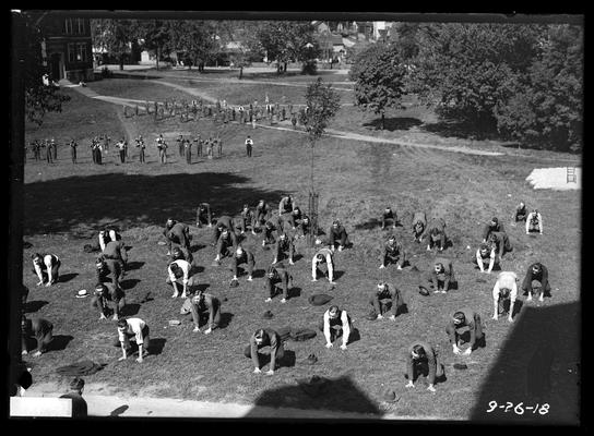 Calisthenics on campus between Engineering buildings and Agricultural Building (Scovell Hall) in background, South Limestone can be seen