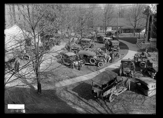 Auto mechanics, cars, auto shop in tent, Carnegie Library to right, low mess hall in background (later a women's gym)