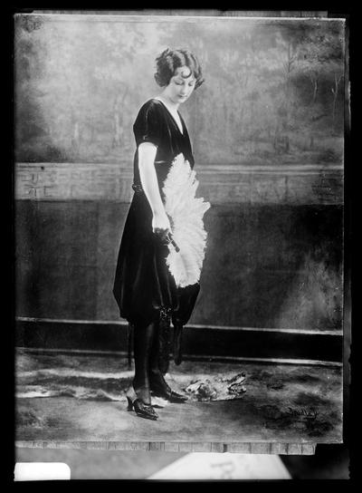 Copy of Bradley photo, young woman with fan of plumes