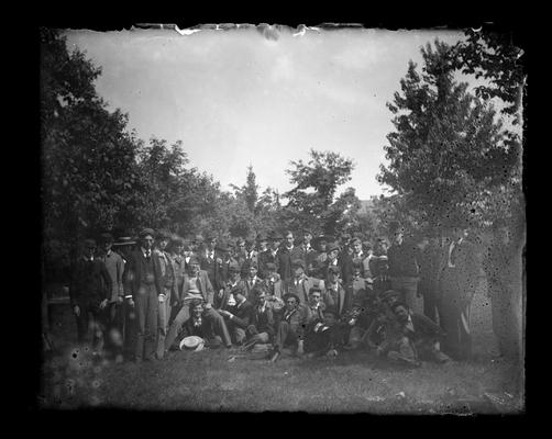 Large group of people standing in a meadow