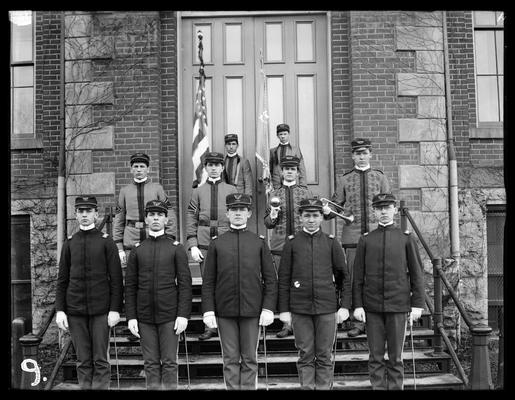 Military band or officers, standing on steps of Administration Building (Main Building)