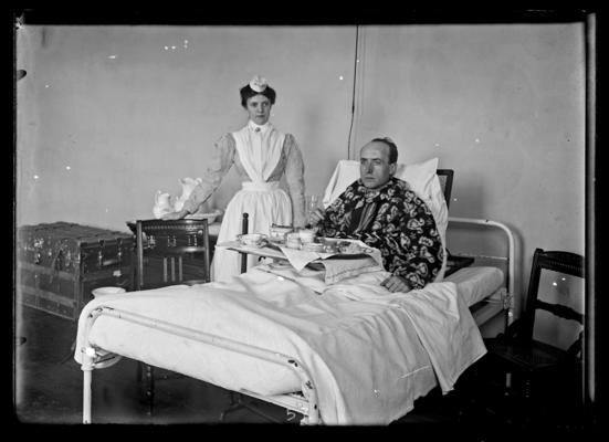 Hospital patient and a nurse at mealtime