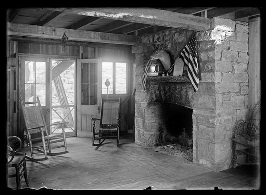 Roger Smith's camp, interior with fireplace