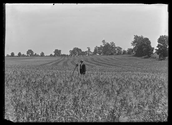 Roger Smith's oats field, man and camera